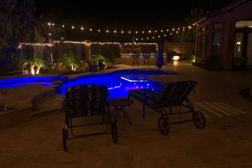 A high definition night time view of a desert landscaped backyard in Arizona.