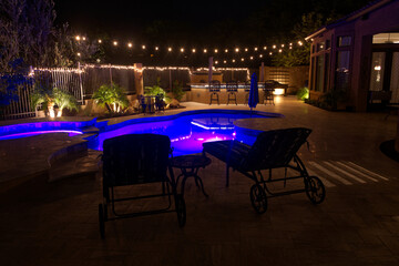 A high definition night time view of a desert landscaped backyard in Arizona.
