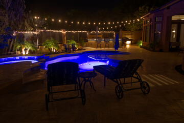A high definition night time view of a desert landscaped backyard in Arizona.
