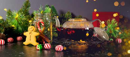Christmas traditional spiced tea. Festive table setting with bokeh lights. Social media web banner. - obrazy, fototapety, plakaty