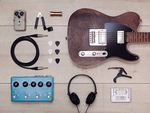 Flat lay with electric guitar and accessories