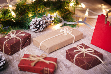 Mini christmas gifts on wooden background with warm and cold tones