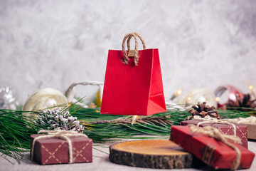 Mini christmas gifts on wooden background with warm and cold tones