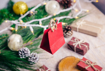 Mini christmas gifts on wooden background with warm and cold tones