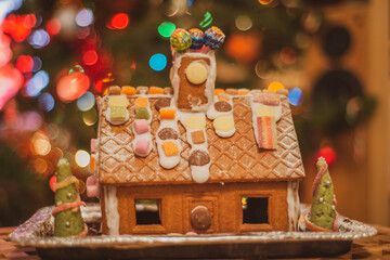 Christmas gingerbread house with sweets and confectionary decorations