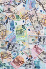 
Dollars and euros are laid out on the table in different bills