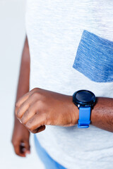 A businessman is showing us his new blue clock.