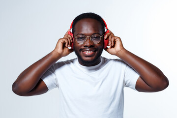 Fototapeta premium A clever executive is wearing gold glasses and listening to music.
