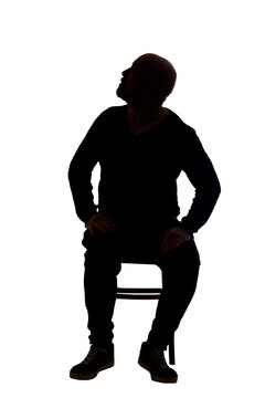 recommend clip art: view of the silhouette of a man sitting on chair with casual clothes looking up