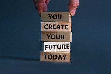 You create your future today symbol. Wooden blocks, words 'You create your future today'. Businessman hand. Beautiful grey background, copy space. Business, motivational and create future concept.
