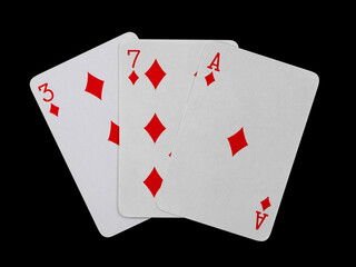 playing cards 3, 7 and ace are fanned out, isolated on a black background