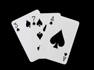 playing cards 3, 7 and ace are fanned out, isolated on a black background