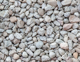 Small light gray, white stone outdoors garden road pavement structure from above, simple high res background texture material closeup, top view, lots of small sized stones. Natural backdrop, nobody