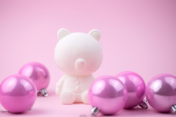 Cute  white toy bear with christmas balls on pink background