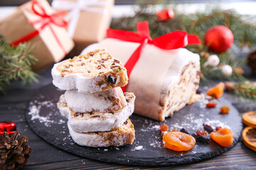 Classical stollen on wooden background. Traditional Christmas festive pastry dessert. Stollen for Christmas