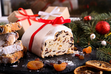 Classical stollen on wooden background. Traditional Christmas festive pastry dessert. Stollen for Christmas