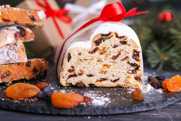 Classical stollen on wooden background. Traditional Christmas festive pastry dessert. Stollen for Christmas