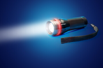 Light beam and flashlight with focusing lens on blue background