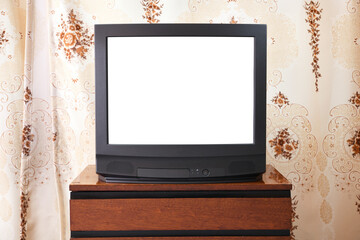 Old TV with white screen on a vintage wooden cabinet, old design in an apartment in the style of...