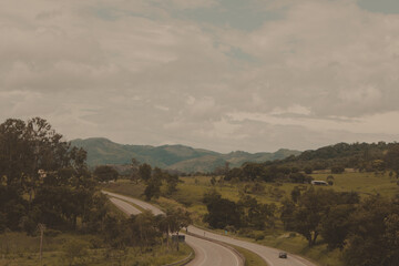 landscape road with trees and mountains