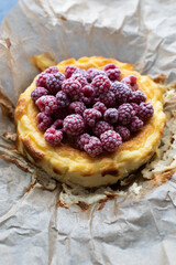 Raspberry homemade cheesecake on wax paper