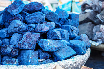 Blue indigo color stones displayed at traditional souk - street market in Marrakech, Morocco,...