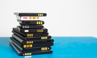 cell phone batteries. stacked. battery recycling. recovery of copper, gold, lithium