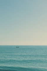 Fototapeta premium Boat in the middle of the sea
