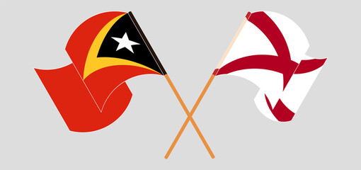 Crossed and waving flags of East Timor and The State of Alabama
