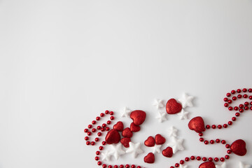 white background with hearts and stars and Christmas jewelry