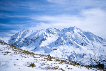 富山県立山町にある立山の冬の雪景色のある風景 Landscape with snowy winter scenery of Tateyama in Tateyama Town, Toyama Prefecture, Japan.