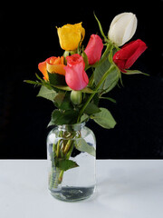 psy of multicolor roses in glass vase