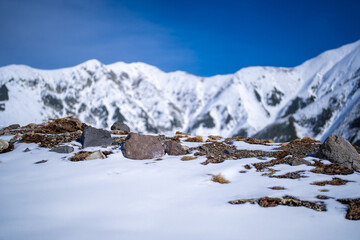 富山県立山町にある立山の冬の雪景色のある風景 Landscape with snowy winter scenery of Tateyama in Tateyama Town, Toyama Prefecture, Japan.