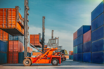 In the shipping industry, a forklift truck raises cargo containers. 