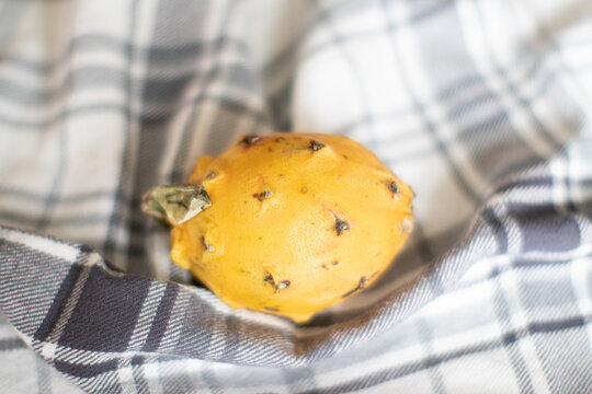 Yellow Dragon Fruit On A Plaid Cloth