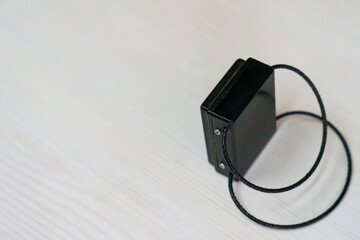 Electronic bracelet for criminals. Gadget for control and monitoring of the execution of punishment