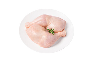 Fresh chicken legs.Three raw whole chicken legs on a white plate on a white isolated background.