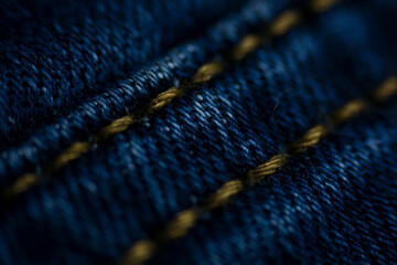 Navy blue textile denim pants background in macro