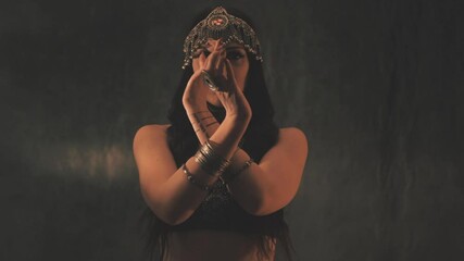 Sensual woman dancing in light and shadow