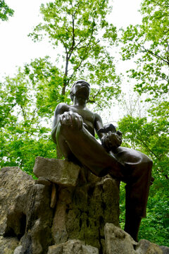 George Washington Carver National Monument in Missouri. Young George Washington Carver statue by Robert Amendola on the Carver trail. The statue depicts George tenderly cradling a plant.