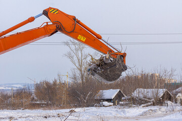 clearing snow and debris from the site before starting construction work