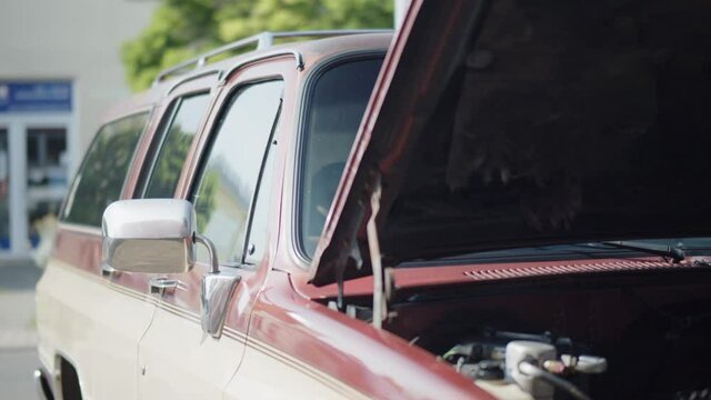 open hood of old van shows engine in sunlight
