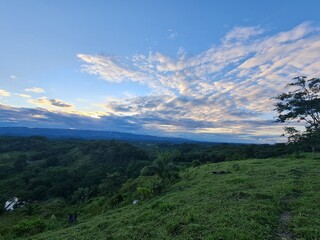 Landscape with blue sky, clouds and vegetation at sunset in Bolivia.