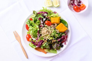 Fresh organic vegetables with quinoa salad on white background ready to eating, Healthy Vegan food, Top view