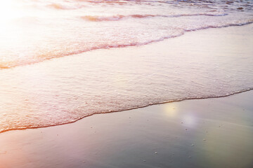 Calm sea waves at orange  sunset