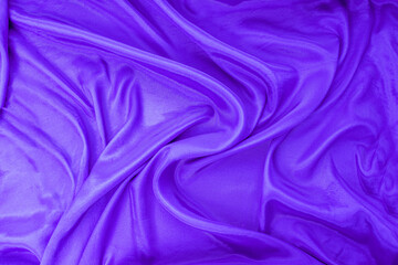 The texture of flowing lavender satin fabric. free space for your text. Canvas texture or...