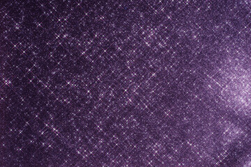 Abstract violet background with sparkles in the shape of stars.