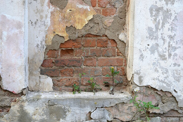 Old weathered Broken Brick wall fragment .