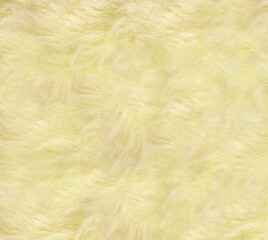 Light yellow synthetic background with plush texture.