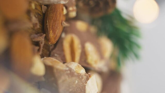 Spanish Turrones. Turron de Chocolate With Puffed Rice Cereal And Almonds. close up, vertical shot